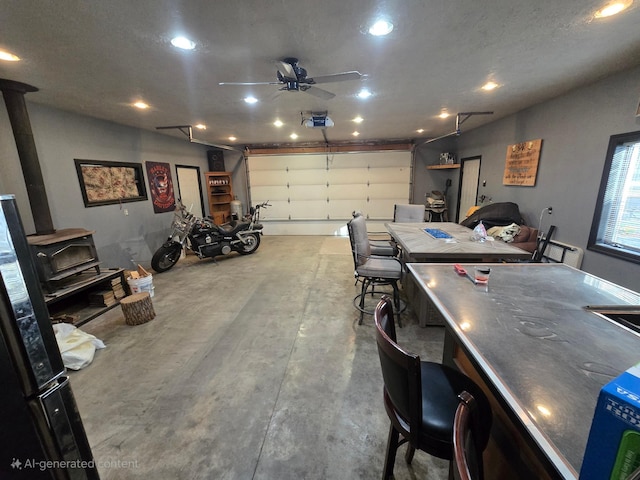 garage featuring a ceiling fan and recessed lighting