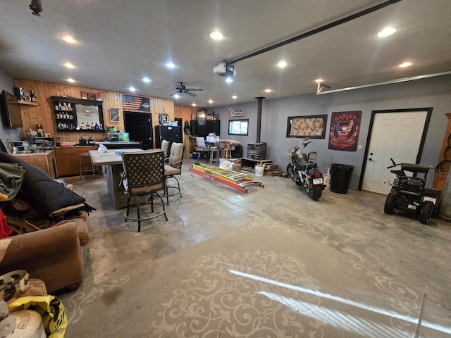 interior space with unfinished concrete floors and recessed lighting