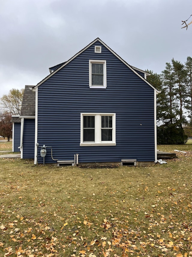 view of property exterior featuring a yard