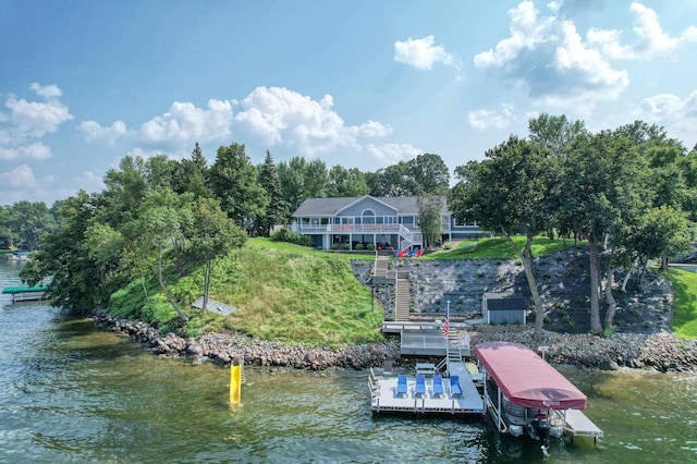 view of dock with a deck with water view