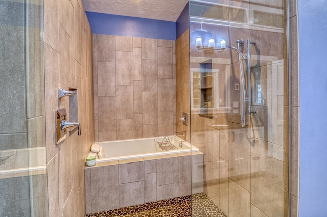 bathroom with separate shower and tub