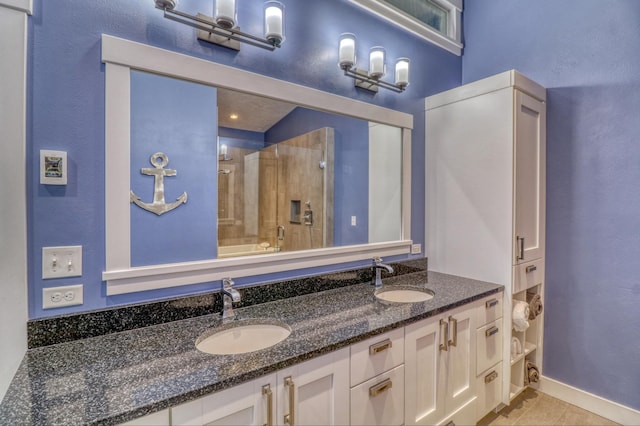 bathroom with vanity, walk in shower, and tile patterned floors