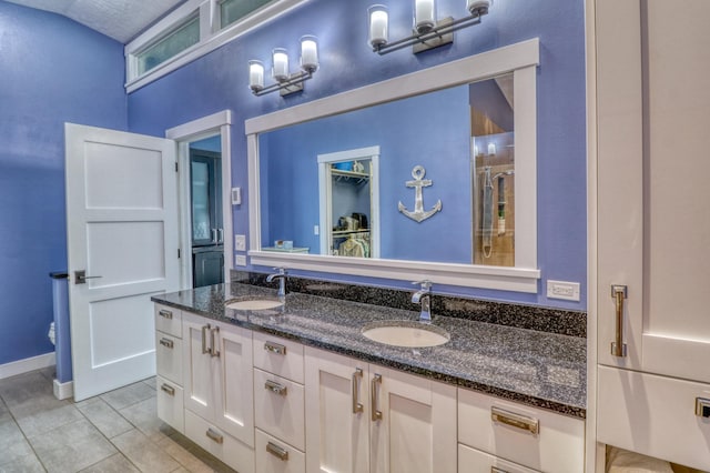 bathroom with vanity, an enclosed shower, toilet, and tile patterned flooring