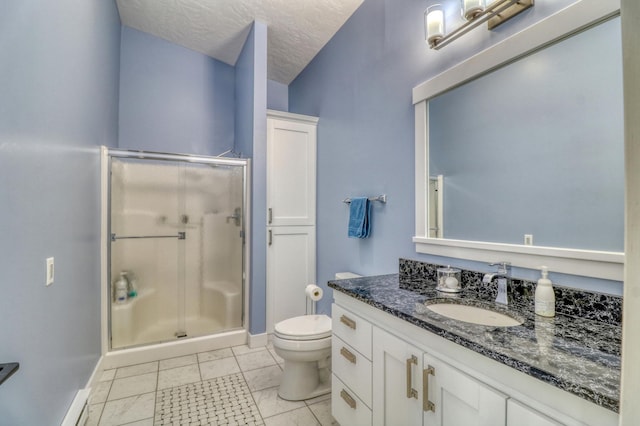 bathroom with a textured ceiling, toilet, vanity, an enclosed shower, and tile patterned floors