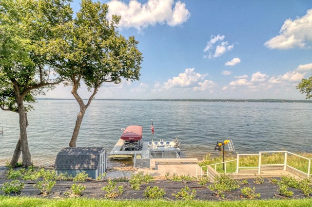 property view of water with a dock