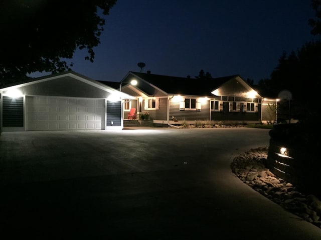 ranch-style home featuring a garage