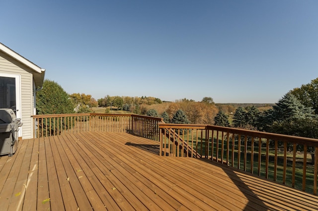 wooden deck with area for grilling