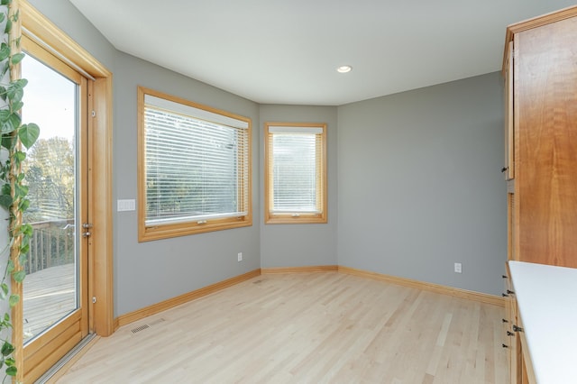 unfurnished room featuring light wood-type flooring