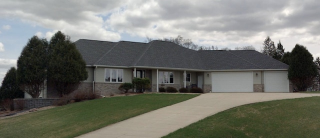 ranch-style home with a garage and a front yard