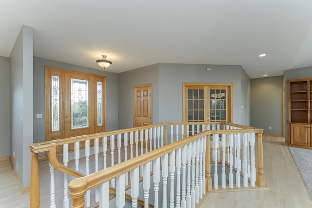 hall with light hardwood / wood-style floors