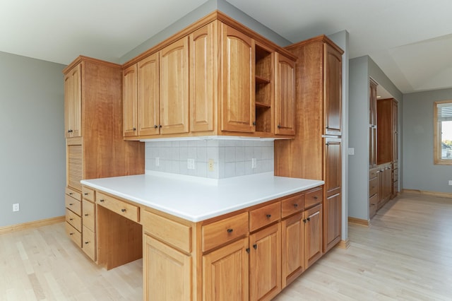 kitchen featuring decorative backsplash and light wood-type flooring