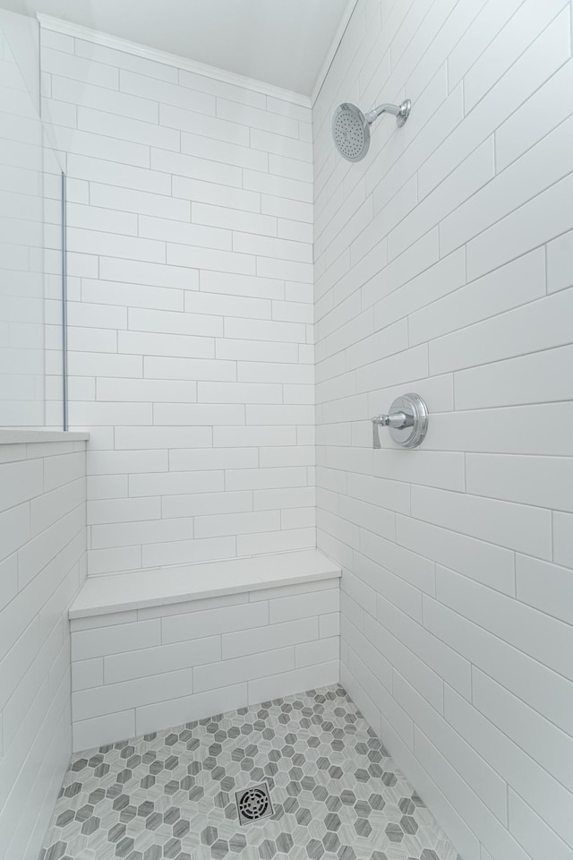 bathroom with a tile shower