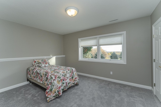 bedroom featuring dark colored carpet