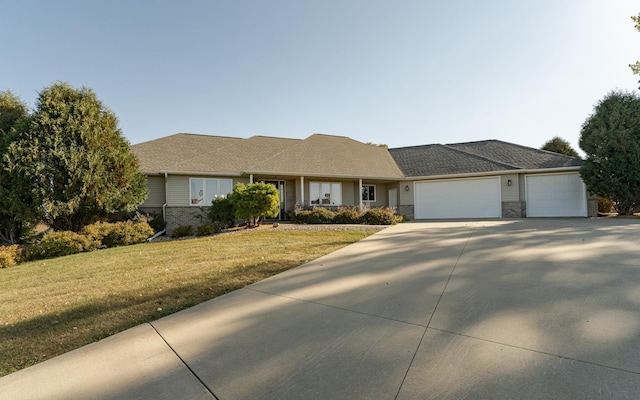 ranch-style home with a garage and a front yard