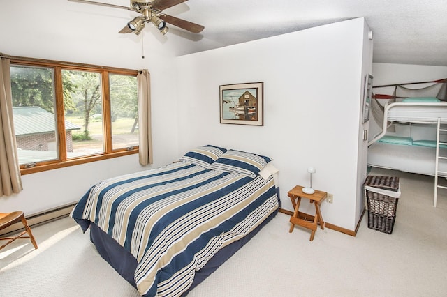 bedroom featuring lofted ceiling, carpet floors, a textured ceiling, and ceiling fan