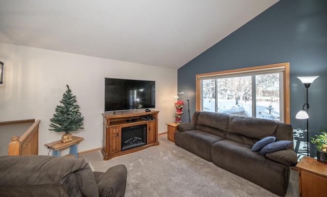 living room featuring carpet flooring and high vaulted ceiling