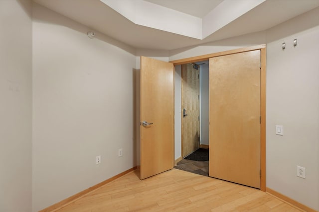 unfurnished bedroom featuring hardwood / wood-style flooring