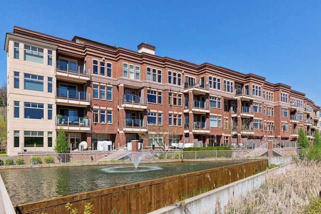 view of property with a water view