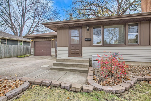 view of exterior entry featuring a garage