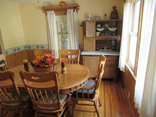 dining space with hardwood / wood-style flooring