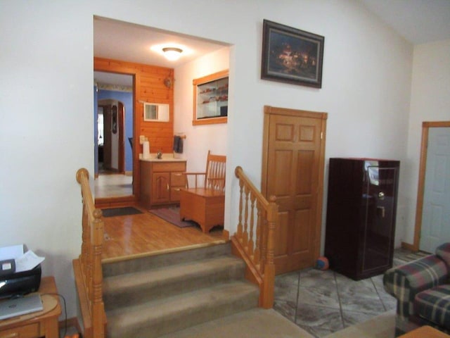 stairway with hardwood / wood-style flooring