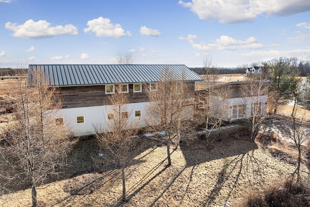 rear view of house with metal roof