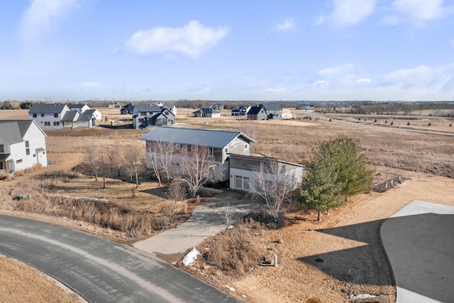 birds eye view of property with a residential view