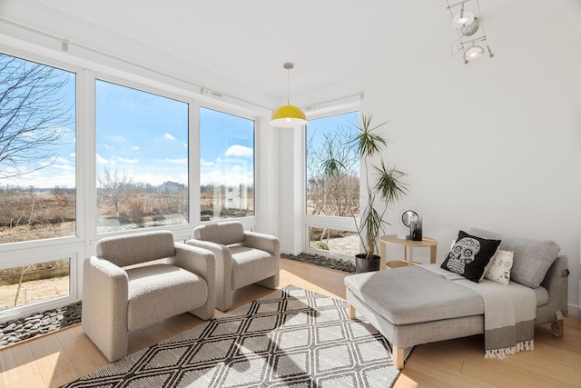 sunroom / solarium featuring a healthy amount of sunlight