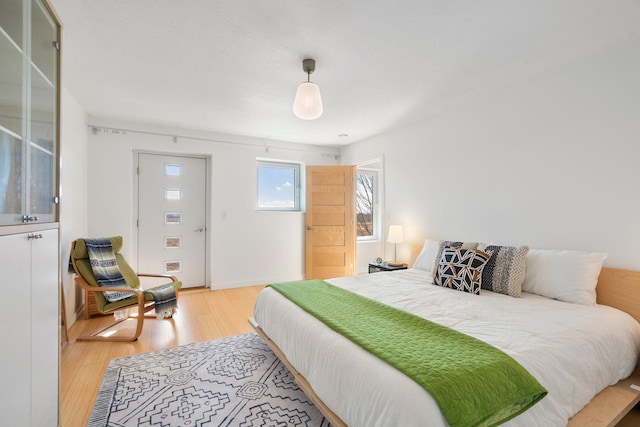 bedroom with light wood-style floors