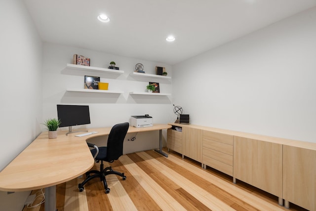 office space with light wood-style floors and recessed lighting