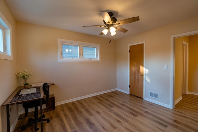 interior space featuring hardwood / wood-style flooring and ceiling fan