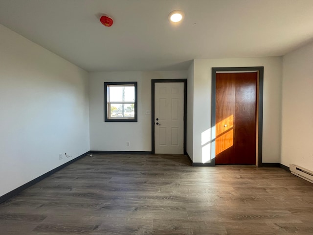 empty room featuring dark wood-type flooring