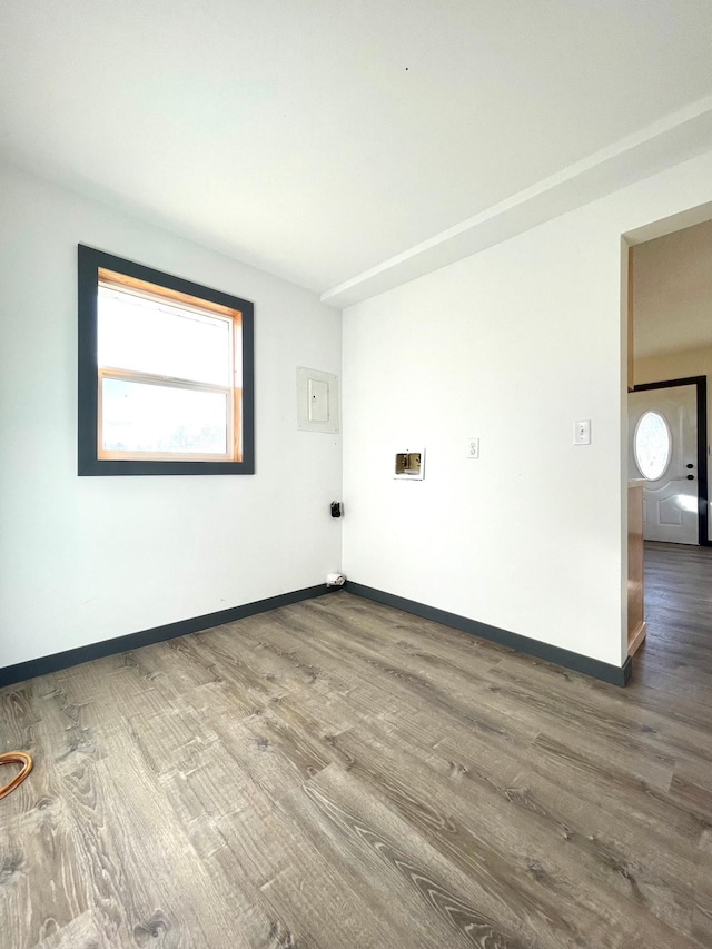 spare room featuring dark wood-type flooring