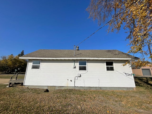 view of home's exterior with a lawn