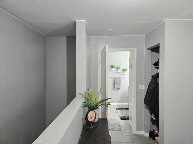 corridor featuring light tile patterned flooring