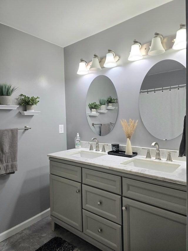 3414 County Road 32 S, South Koochiching Unorg Terr, MN 56654 - bathroom with baseboards, double vanity, and a sink