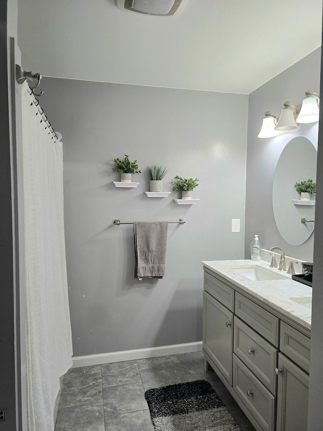 bathroom with vanity and tile patterned flooring