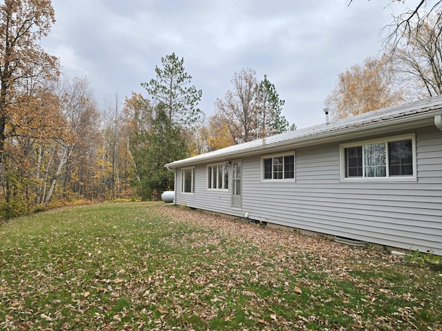 view of home's exterior featuring a yard