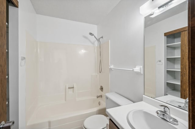 full bathroom with vanity, toilet, a textured ceiling, and  shower combination