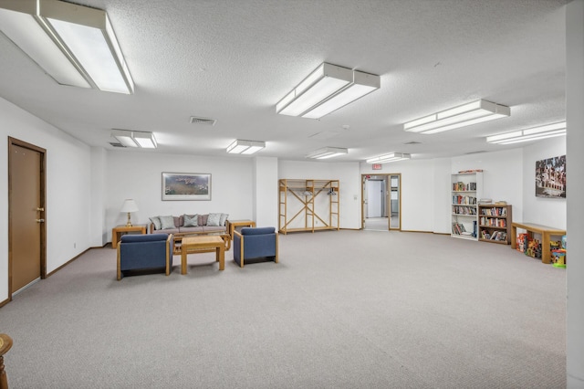 interior space with a textured ceiling and carpet floors