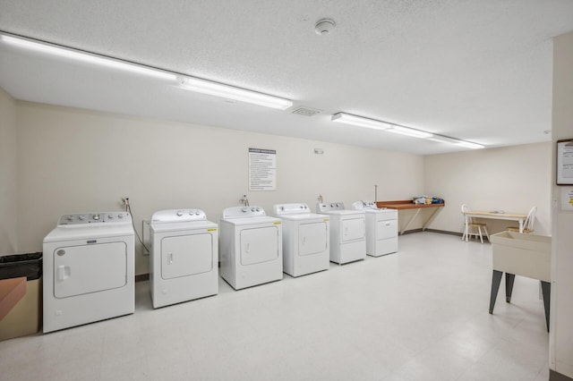 laundry room with washer and clothes dryer