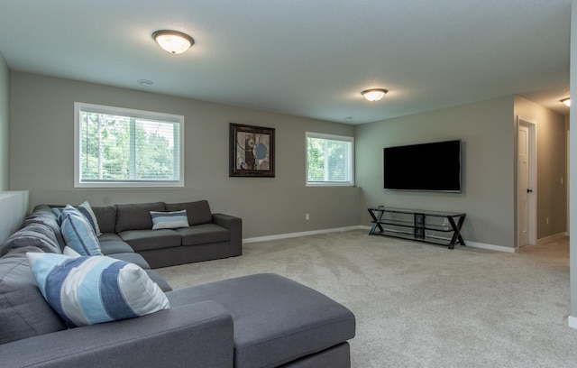 living room featuring light carpet and plenty of natural light