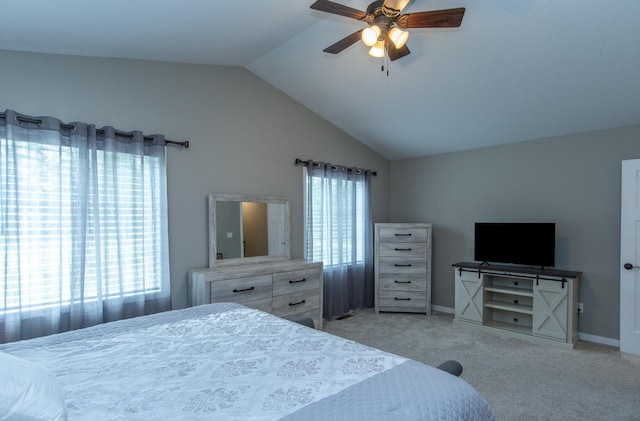 bedroom with vaulted ceiling, light carpet, and ceiling fan