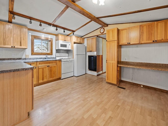 kitchen with sink, lofted ceiling with beams, light wood-type flooring, and white appliances