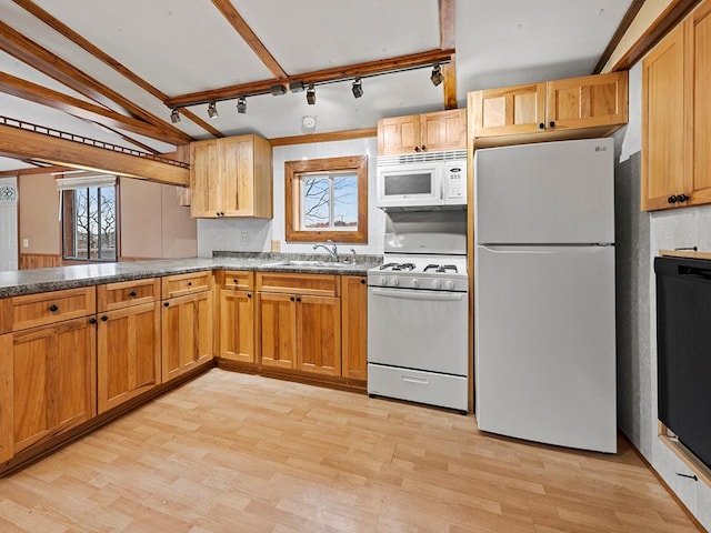 kitchen featuring light hardwood / wood-style flooring, sink, track lighting, and white appliances