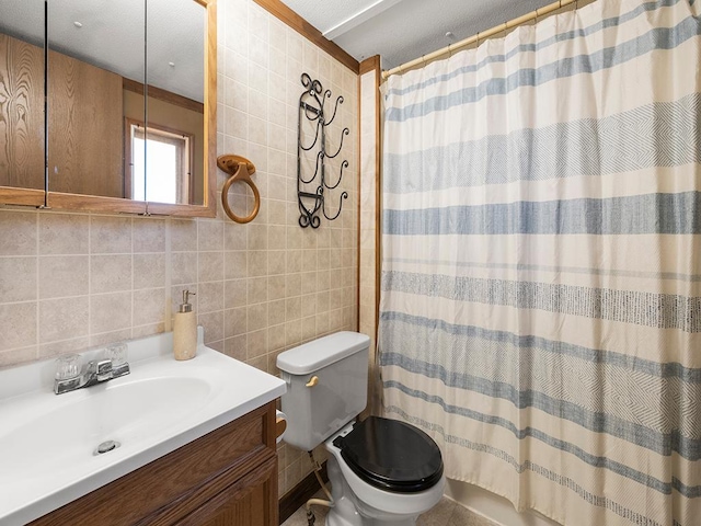 bathroom featuring tasteful backsplash, toilet, walk in shower, tile walls, and vanity