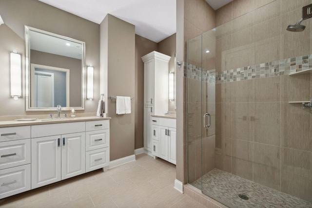 bathroom featuring walk in shower and vanity