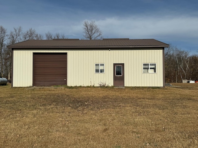 garage featuring a lawn