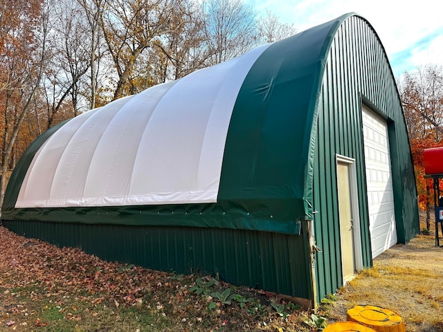 view of outbuilding with a garage