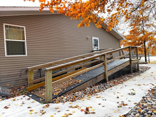 view of side of property with a wooden deck